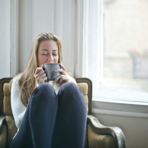 Woman Holding Gray Ceramic Mug